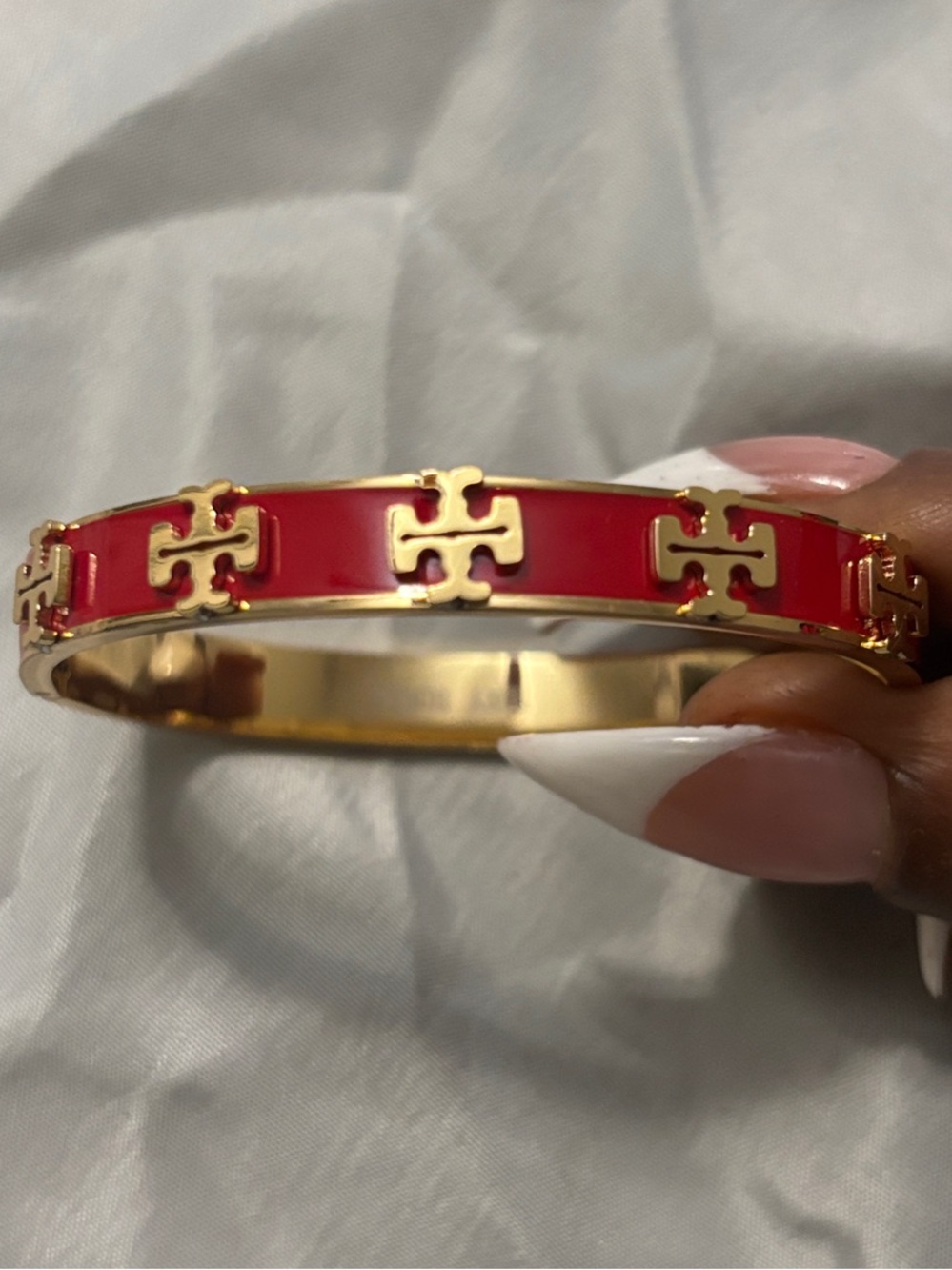 Gold-Tone Bracelet with Red Enamel and Logo Cutouts